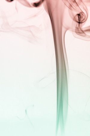 colorful smoke on dark backgroundの写真素材