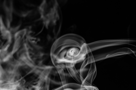 colorful smoke on dark backgroundの写真素材