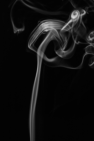 colorful smoke on dark backgroundの写真素材