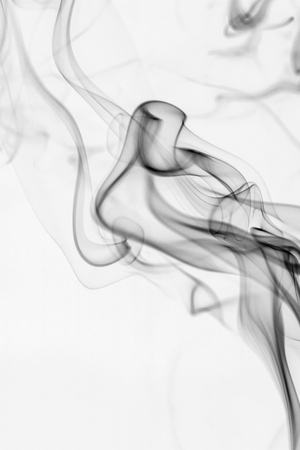 colorful smoke on dark backgroundの写真素材