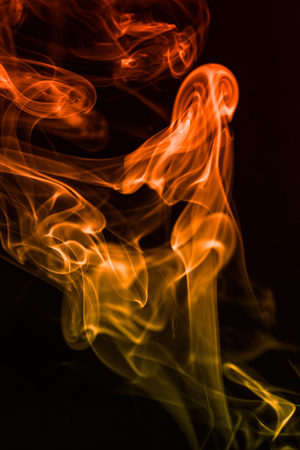 colorful smoke on dark backgroundの写真素材