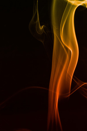 colorful smoke on dark backgroundの写真素材