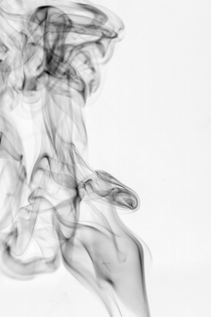 colorful smoke on dark backgroundの写真素材