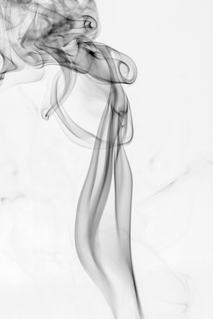 colorful smoke on dark backgroundの写真素材