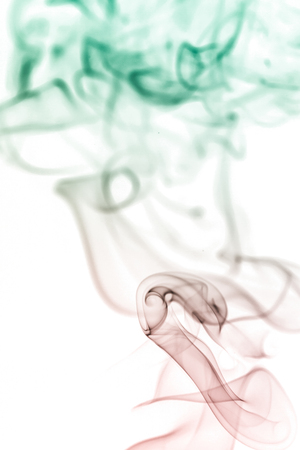 colorful smoke on dark backgroundの写真素材
