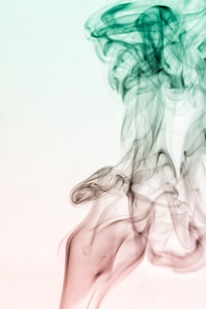 colorful smoke on dark backgroundの写真素材