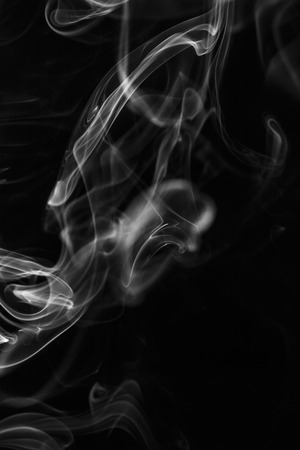 colorful smoke on dark backgroundの写真素材