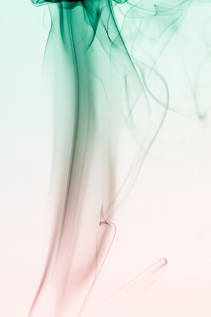 colorful smoke on dark backgroundの写真素材