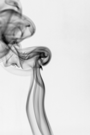 colorful smoke on dark backgroundの写真素材