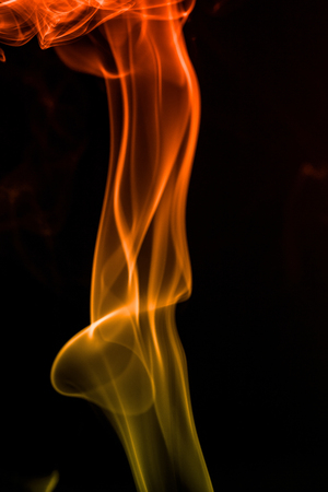 colorful smoke on dark backgroundの写真素材