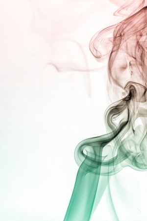 colorful smoke on dark backgroundの写真素材