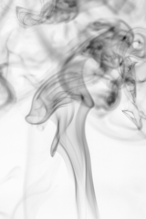 colorful smoke on dark backgroundの写真素材