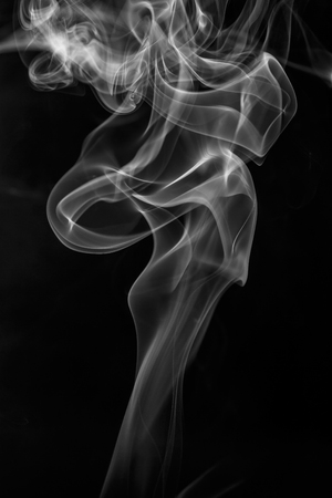 colorful smoke on dark backgroundの写真素材