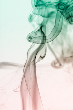 colorful smoke on dark backgroundの写真素材
