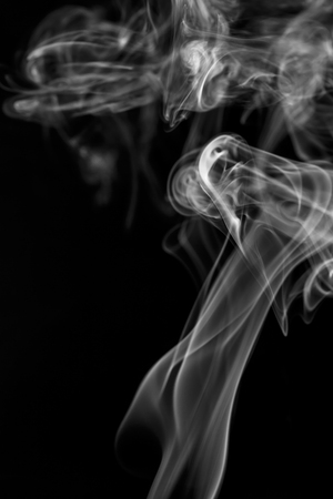 colorful smoke on dark backgroundの写真素材