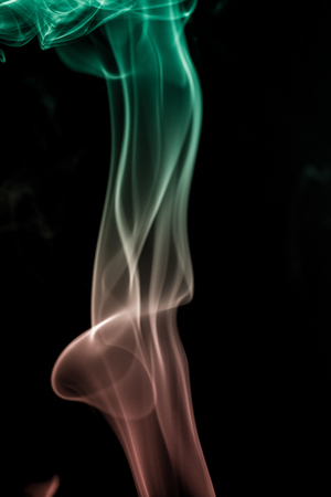 colorful smoke on dark backgroundの写真素材