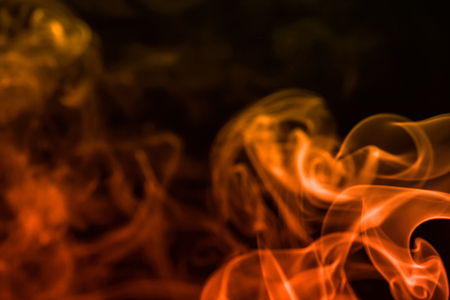 colorful smoke on dark backgroundの写真素材