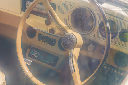 Old car standing beside a treeの写真素材