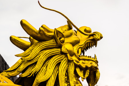 Chinese golden dragon isolated on white with clipping path.Golden traditional chinese dragon isolated on white background. Feng Shuiの写真素材