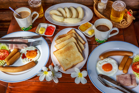 Breakfast served with coffee, orange juice, croissants, cereals and fruits. Balanced diet.の写真素材