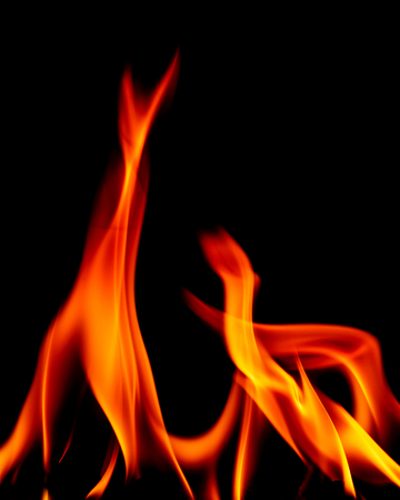 Real fire line flames isolated on black background. Mockup fire wall.