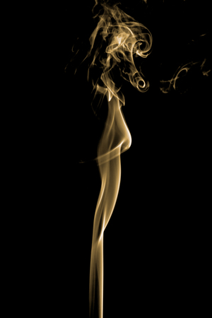 colorful smoke on dark backgroundの写真素材