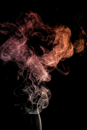 colorful smoke on dark backgroundの写真素材