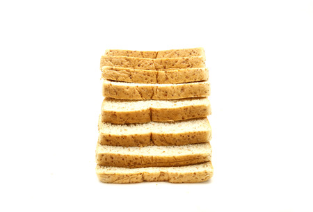 Whole wheat bread sliced isolated on white background.の写真素材
