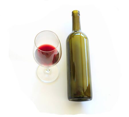 Top view red wine glass, wine bottle on whiteの写真素材