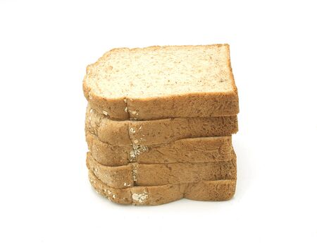 Whole wheat grain bread Stacked on white background, isolatedの写真素材