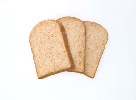 three fresh whole wheet slices isolated on white background, breadの写真素材