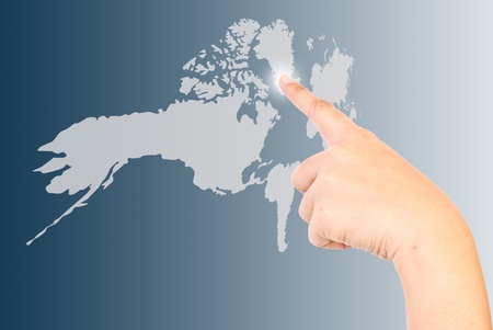 Finger press the world map.の写真素材