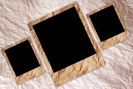 Vintage photo frame on the vintage paper texture background.