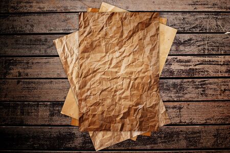 Vintage paper on the classic wooden texture background.の写真素材
