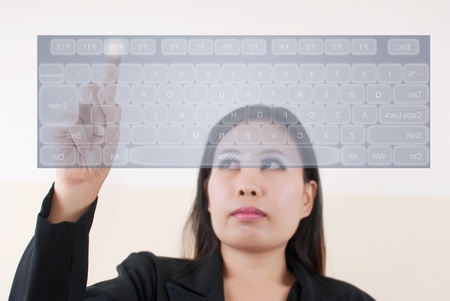 Business lady pressing transparent keyboard.の写真素材