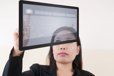 Business lady pressing transparent keyboard.