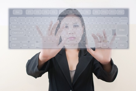 Business lady pressing transparent keyboard.の写真素材