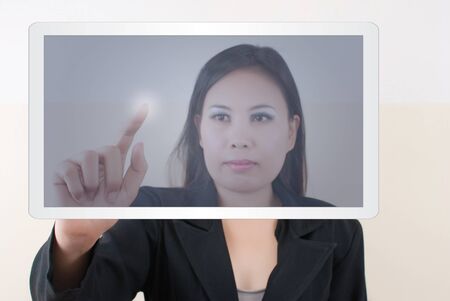 Business lady pressing on tablet screen.の写真素材