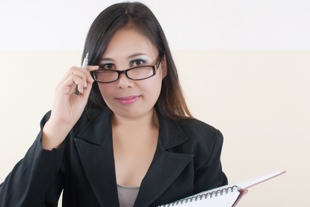 Business lady thinking with her work.の写真素材