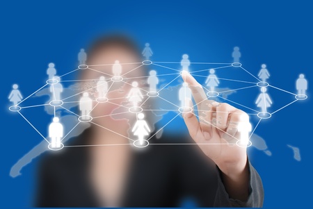 Asian business lady pushing social network word communication.の写真素材