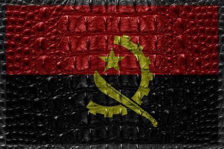Vintage Angola flag with crocodile skin.の写真素材