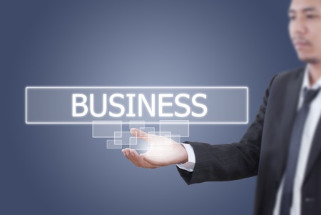 Asian businessman pushing business wordの写真素材