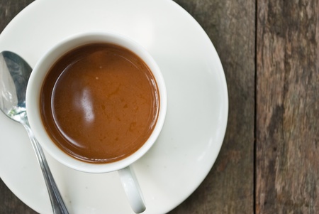 Coffee cup on the wood texture.の写真素材
