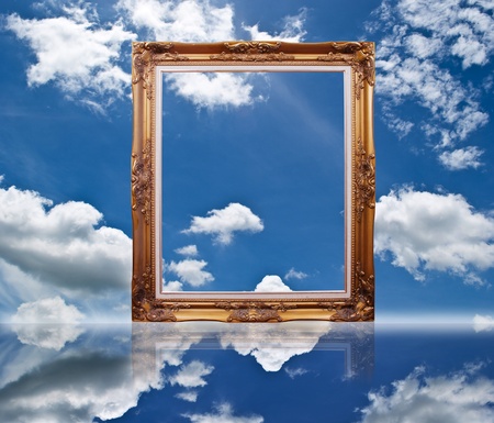 Photo frame on the blue sky field.の写真素材