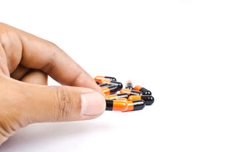 Hand putting medicineの写真素材