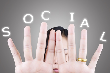Lady finger pushing Social word.の写真素材