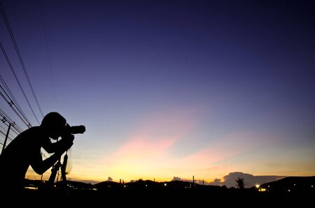Photographer silhouette with sunset.の写真素材