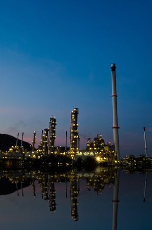 Reflection of petrochemical industry on sunset dark blue sky のeditorial素材