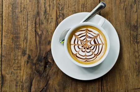 Coffee cup on the wood texture background.の写真素材