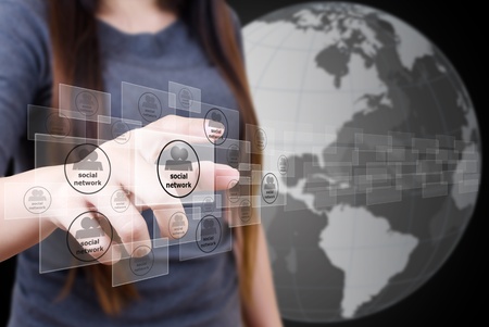 Business lady pushing Social Network button の写真素材